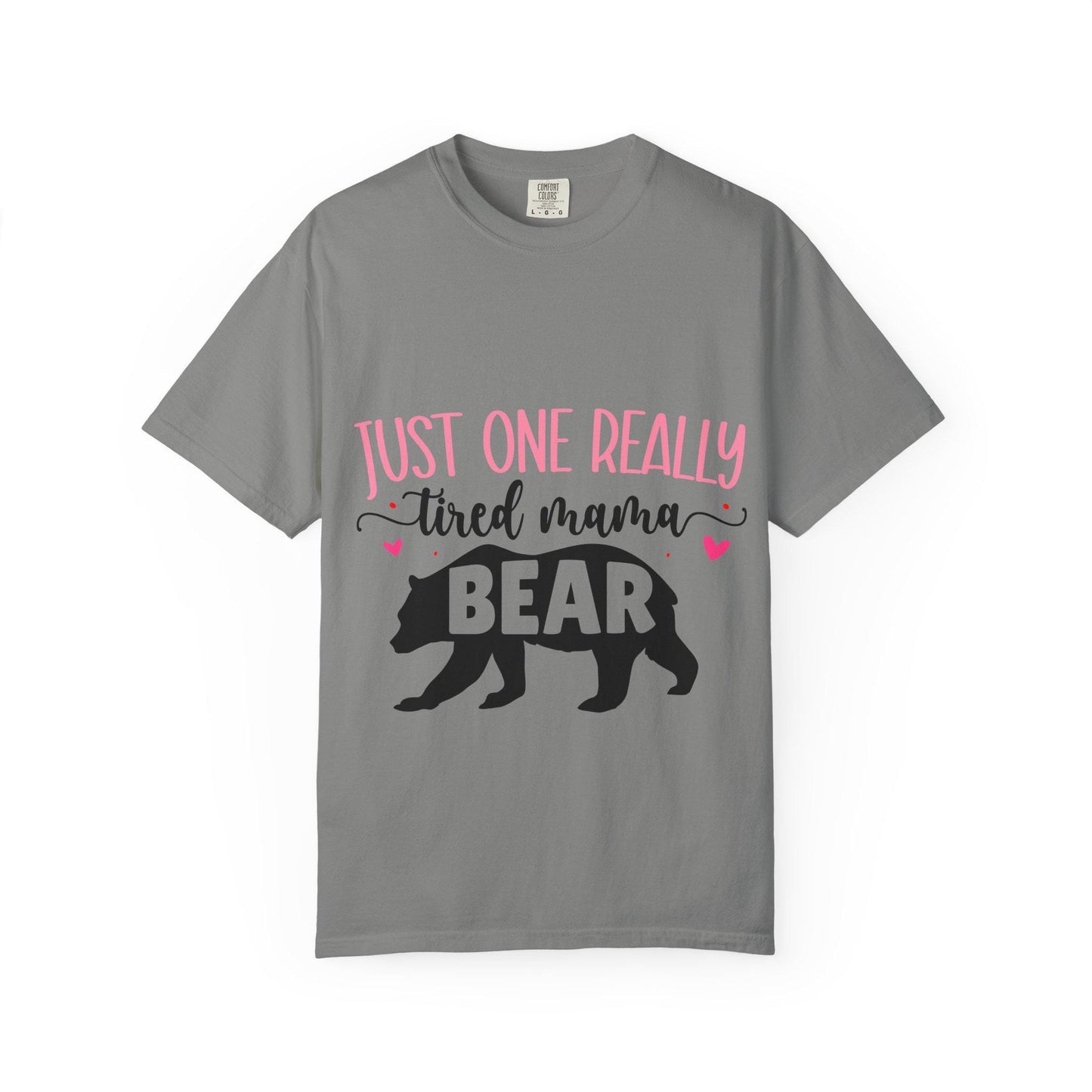 Gray Comfort Colors short sleeve t-shirt featuring the phrase “Just One Really Tired Mama Bear” in playful pink and black fonts. The design includes a bold black silhouette of a walking bear with the word “BEAR” in pink block letters inside the bear, and small pink hearts for added charm. A cozy, fun, and relatable shirt for moms, perfect for Mother’s Day, new moms, or as a comfy everyday mom life tee.