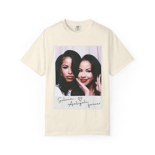 May include: Ivory t-shirt with a photo of two women in a Polaroid frame. The text below the photo reads 'Selena Aaliyah forever'.