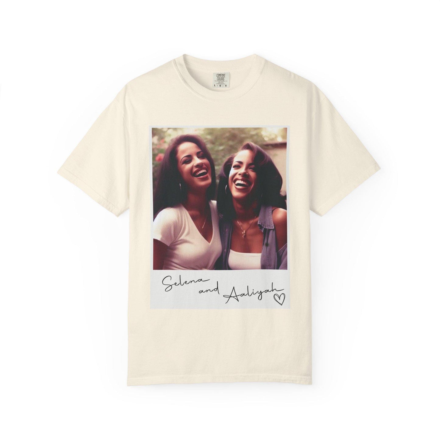 May include: Ivory t-shirt with a white photo of two women smiling. The photo is in a white frame with the text 'Selena and Aaliyah' and a heart.