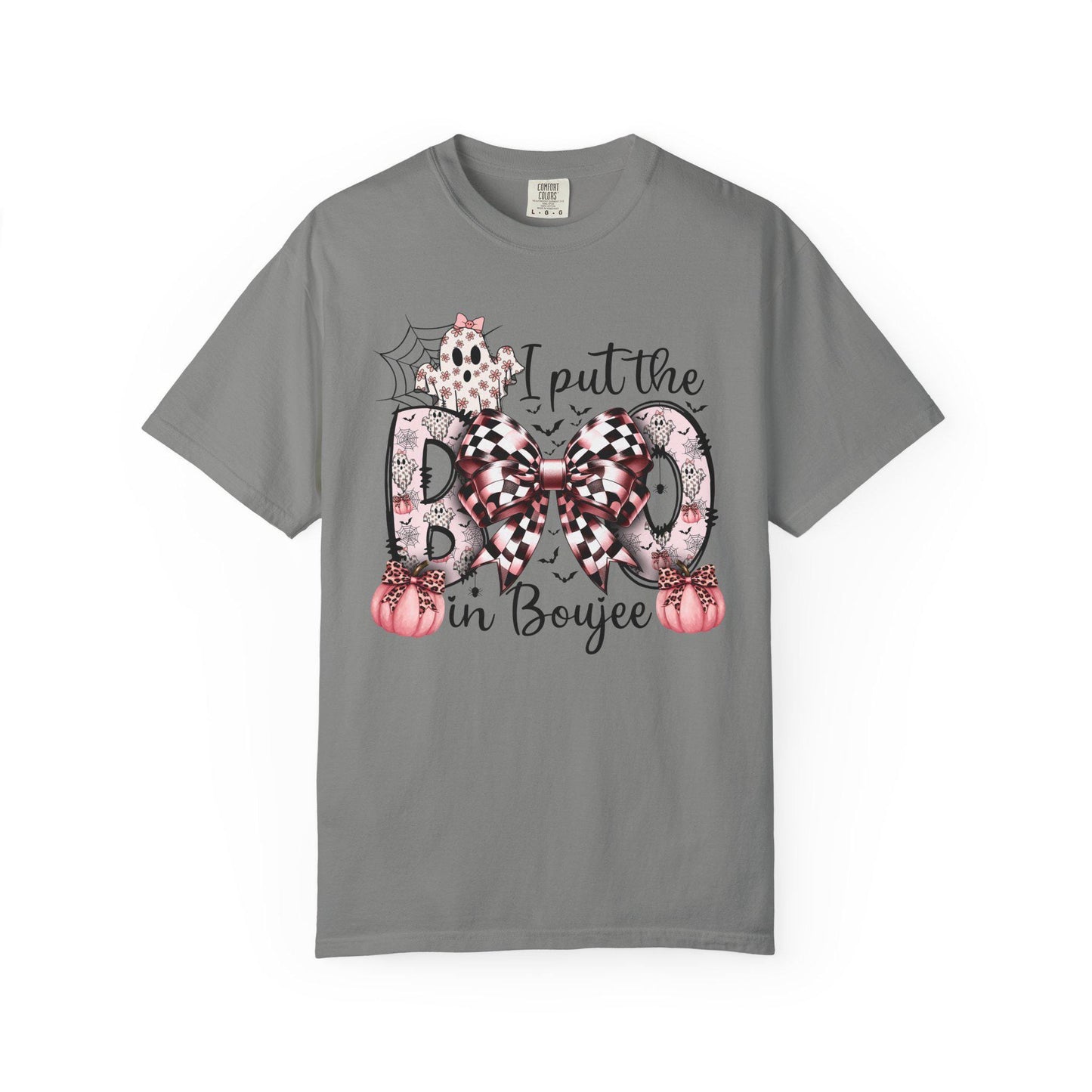 Granite short-sleeve t-shirt with a playful Halloween-themed design that reads “I put the BOO in Boujee.” The word “BOO” is decorated with black and pink patterns, including leopard print and buffalo plaid, accented by a large checkered bow. Surrounding the text are cute seasonal details such as pink pumpkins, a ghost, bats, and a spider web, giving the shirt a stylish and boujee spooky vibe.